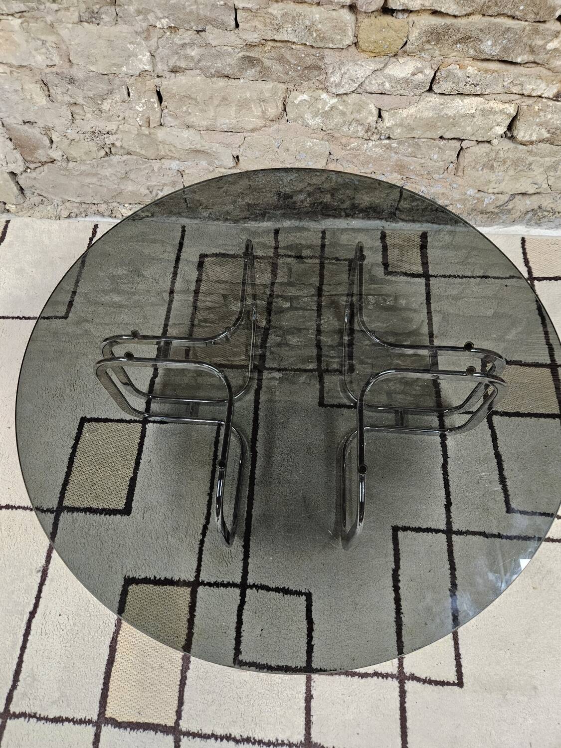 Round chrome coffee table with smoked glass