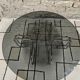 Round chrome coffee table with smoked glass