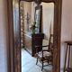 Antique wardrobe with one door and mirror.