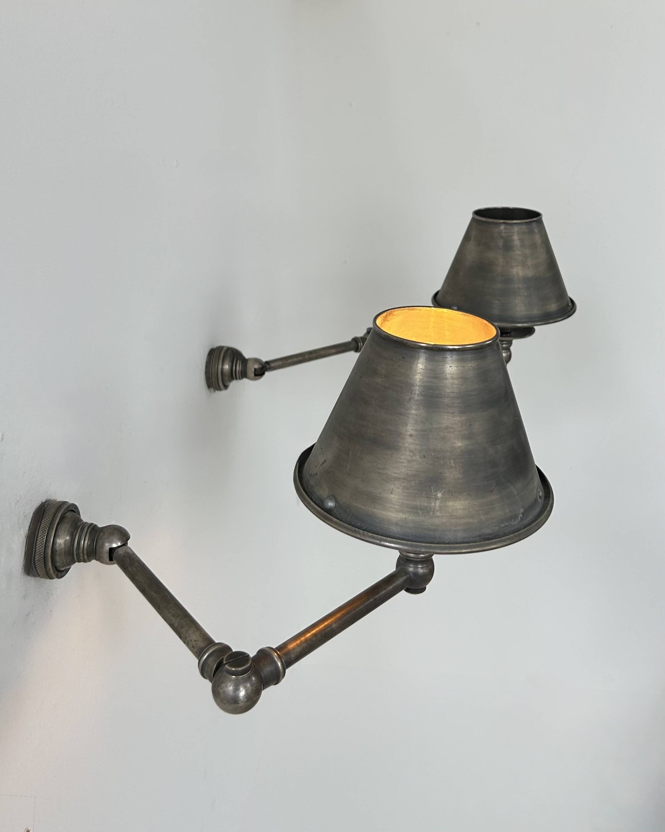 Pairs of adjustable vintage wall lights in steel, France, 1970.