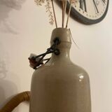 Old stoneware bottle vase