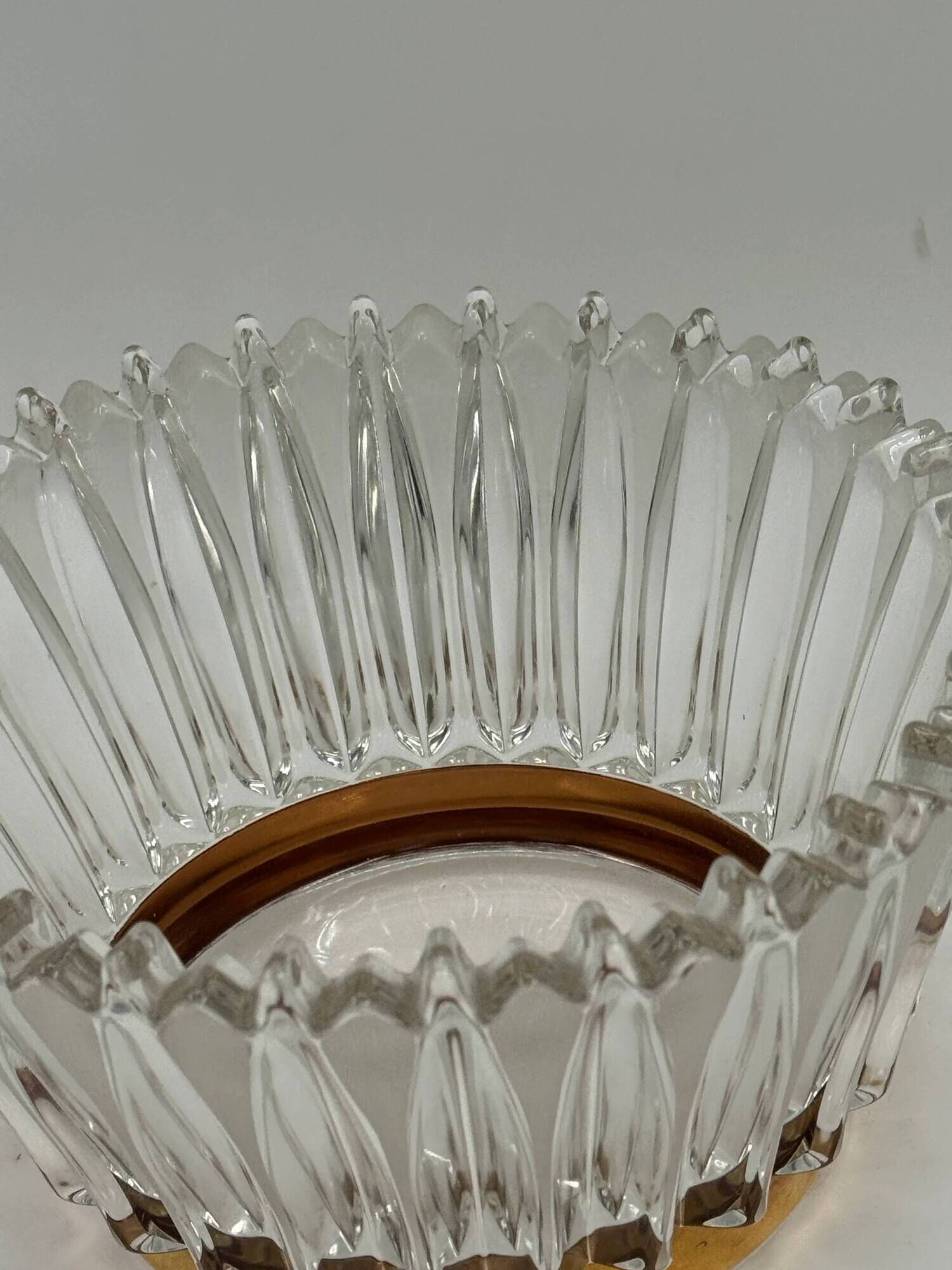 Crown coupe in ribbed glass with a brass base.