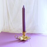 Golden brass hand candle holder decorated with leaves