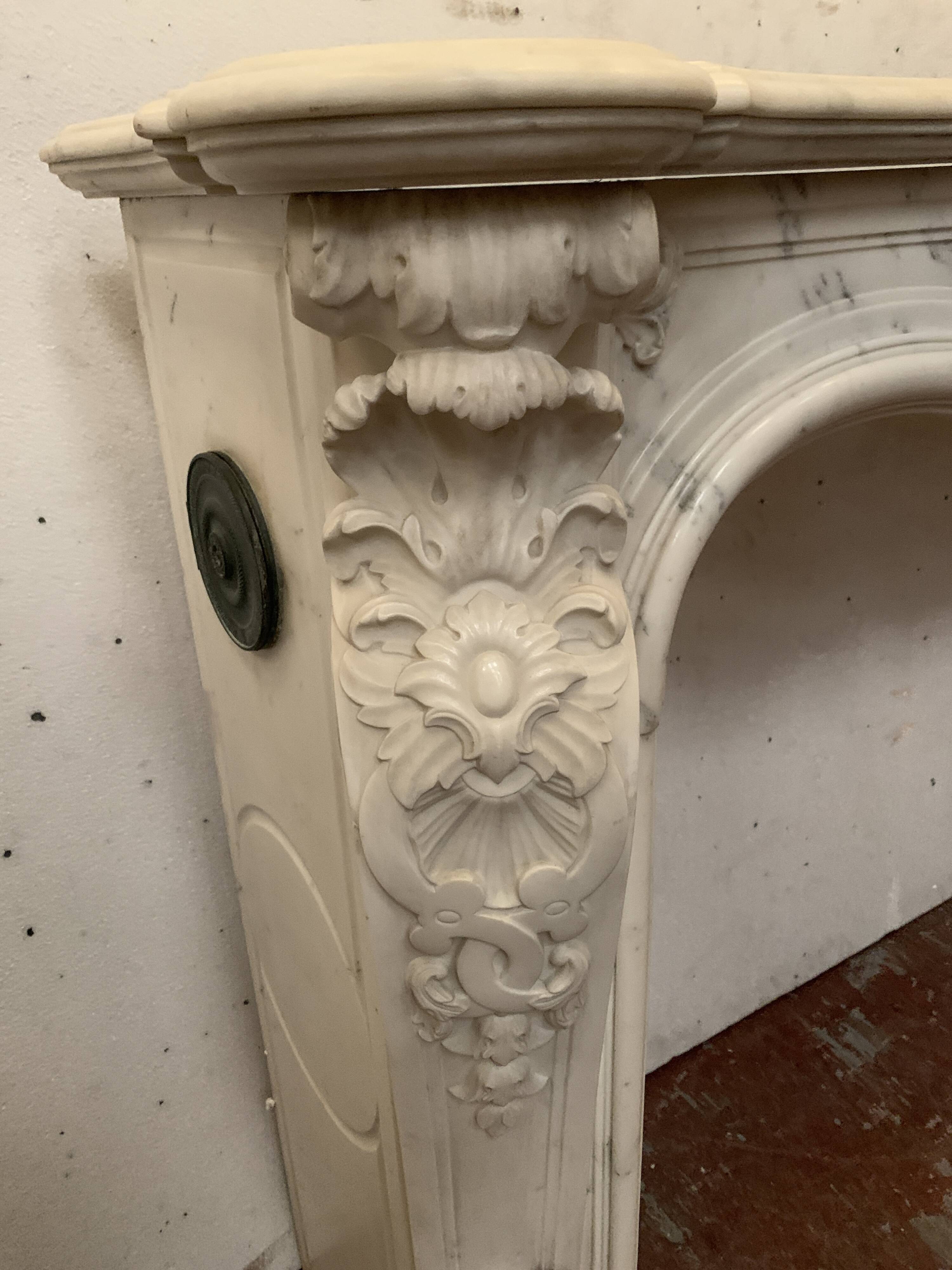 Louis XV style fireplace in white Carrara marble, 19th century