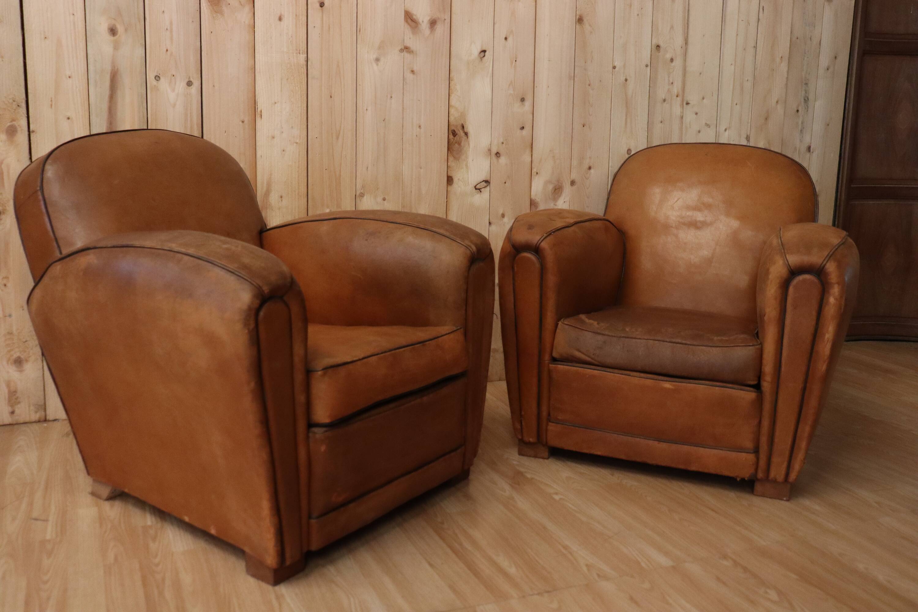 Pair of Art Deco leather club armchairs from the 1930s.
