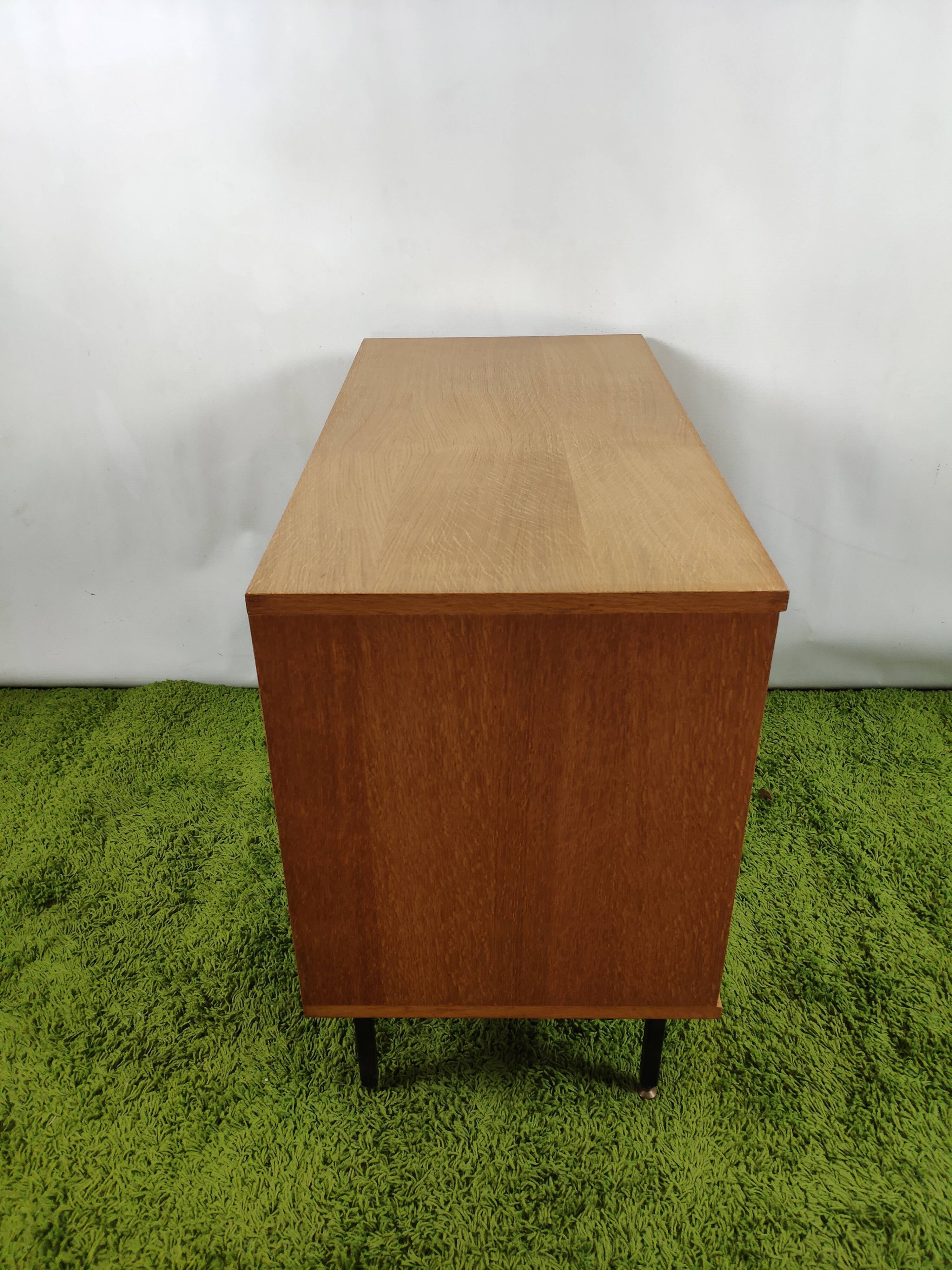 Wooden chest of drawers with gilded handle