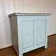 Antique low polychrome sideboard with floral decoration.