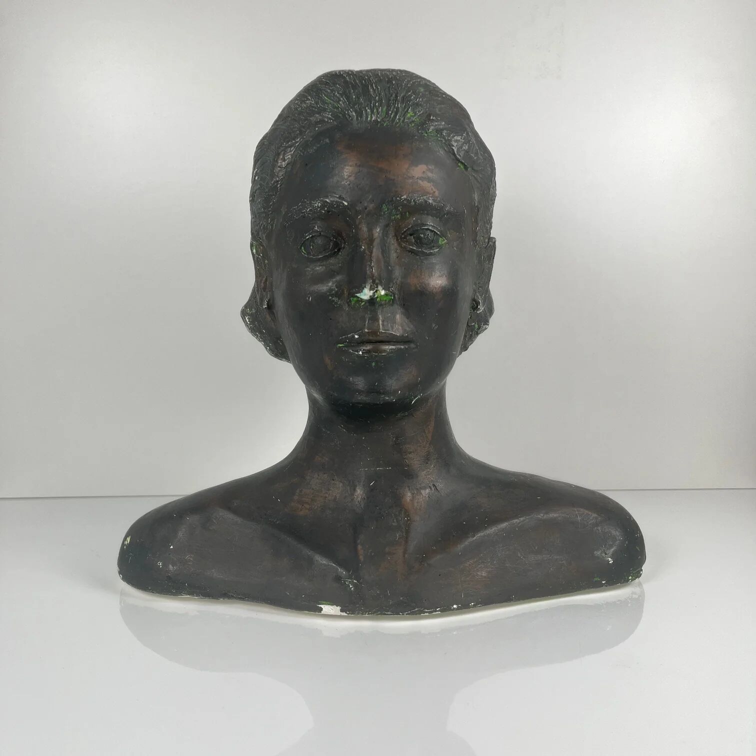 Female bust in neoclassical style in plaster by M. Mongey, 20th century.