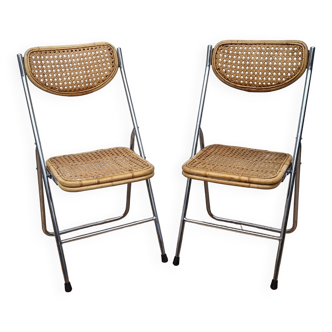 Pair of vintage metal and cane folding chairs