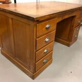 Old wooden desk has double subwoofer