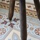 Old dark wood tripod stool