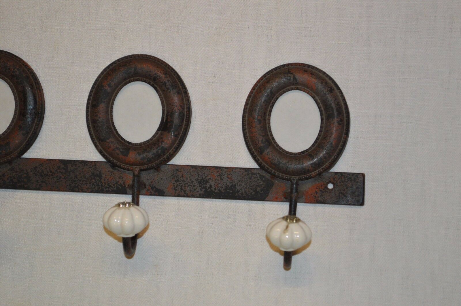 Iron coat holder with picture frames