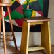 Art-populaire workshop stool in patinated painted wood