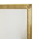Miroir Deknudt en or Hollywood Regency biseauté 92 cm