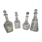 Set of four glass carafes