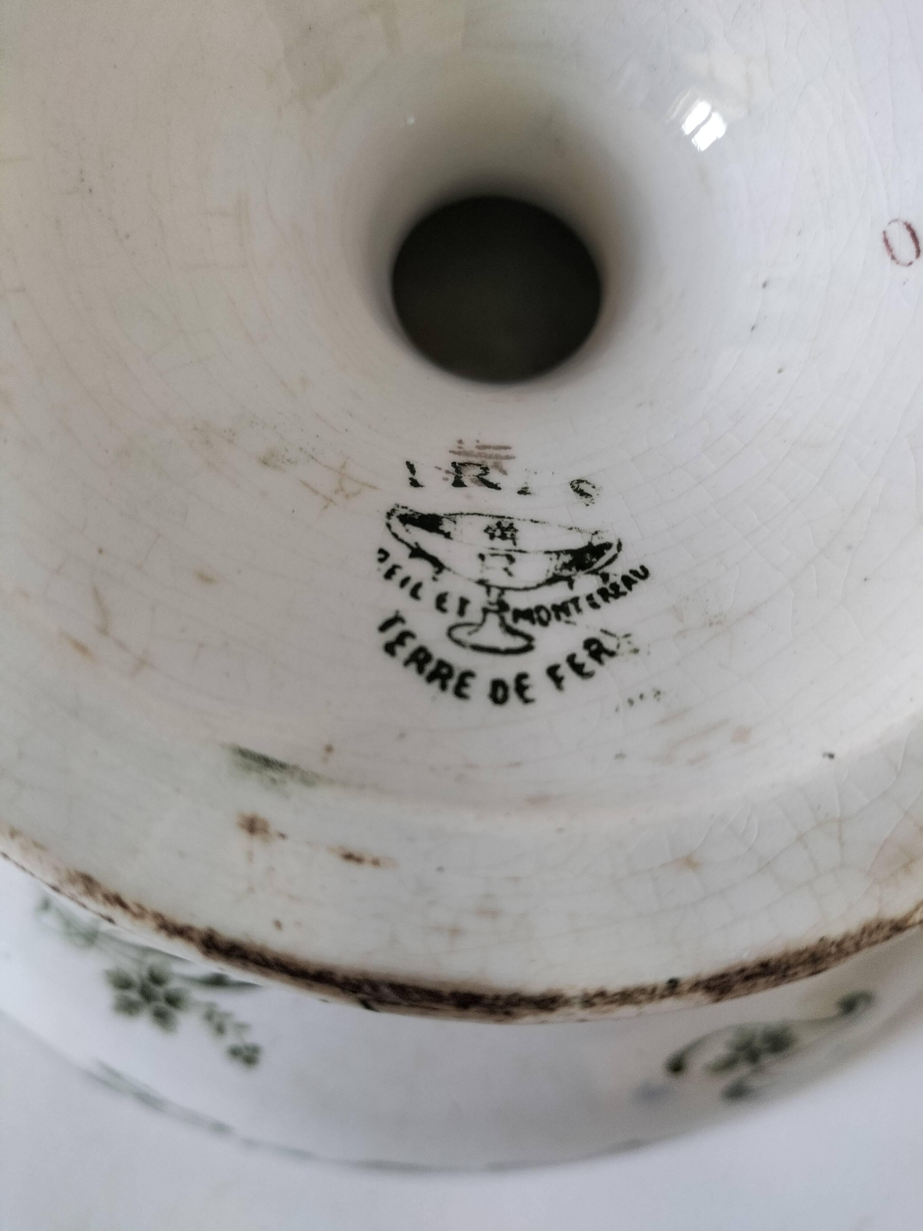 Plate on pedestal Iris Creil Montereau Terre de Fer from the 1900s