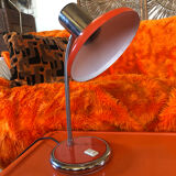 Orange articulated desk lamp