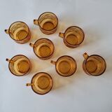 Set of 8 cups and amber glass under cups
