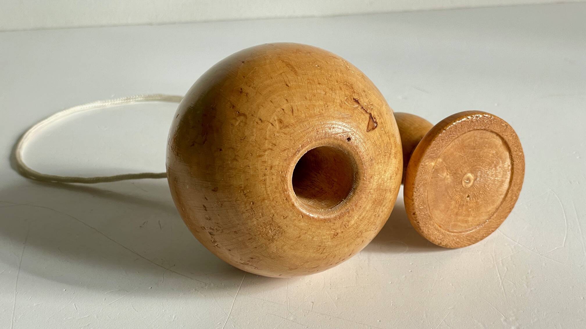 Vintage wooden cup-and-ball toy