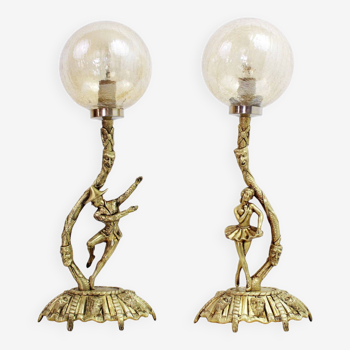 Pair of Commedia Dell Arte lamps in bronze and glass