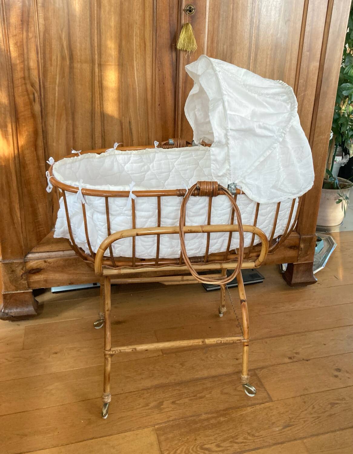 Bamboo, rattan, wicker cradle bassinet from the 1960s with a foldable support.