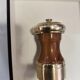Varnished wood and brushed brass pepper mill
