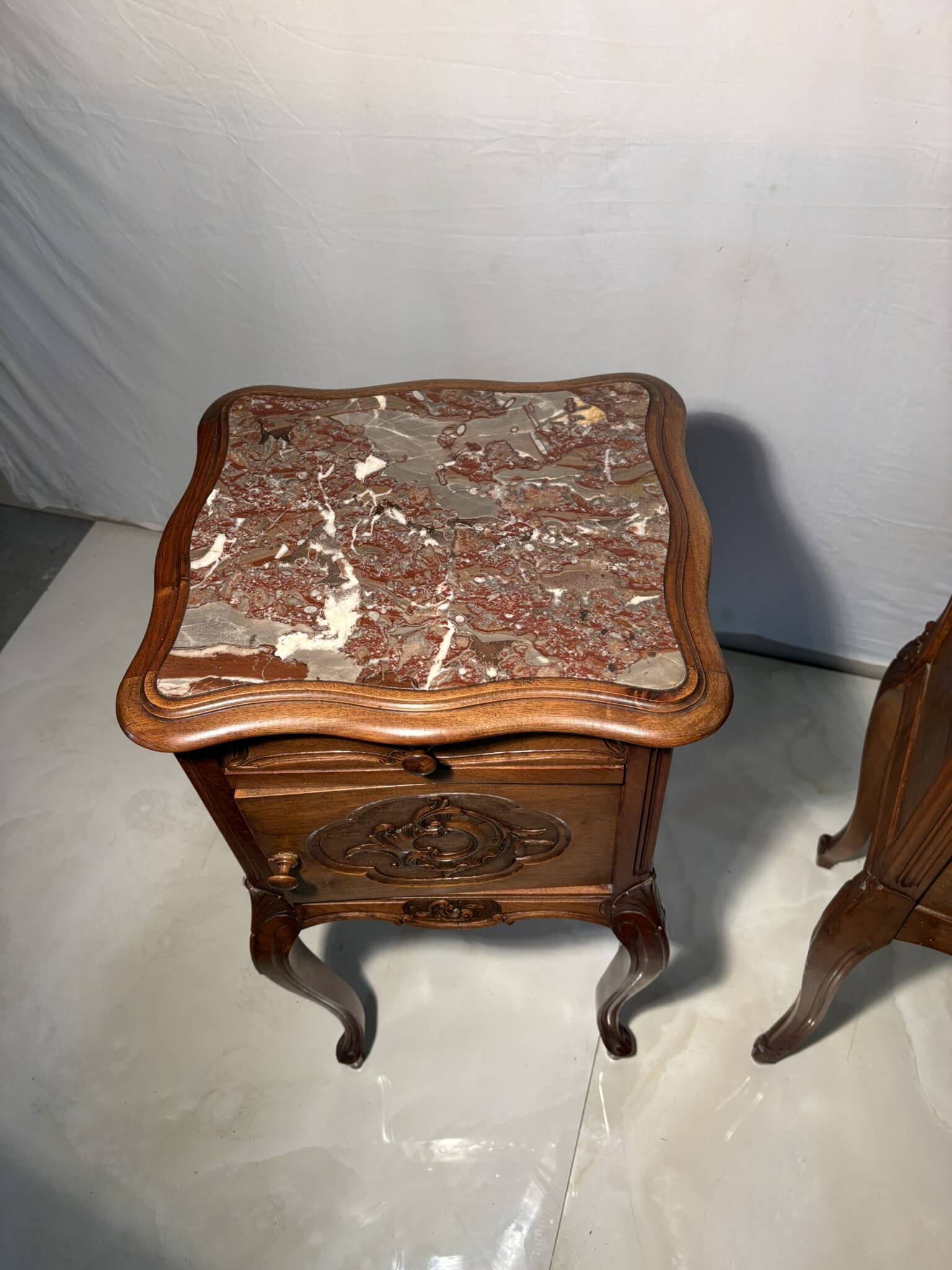 Pair of antique bedside tables with marble top and ceramic niche