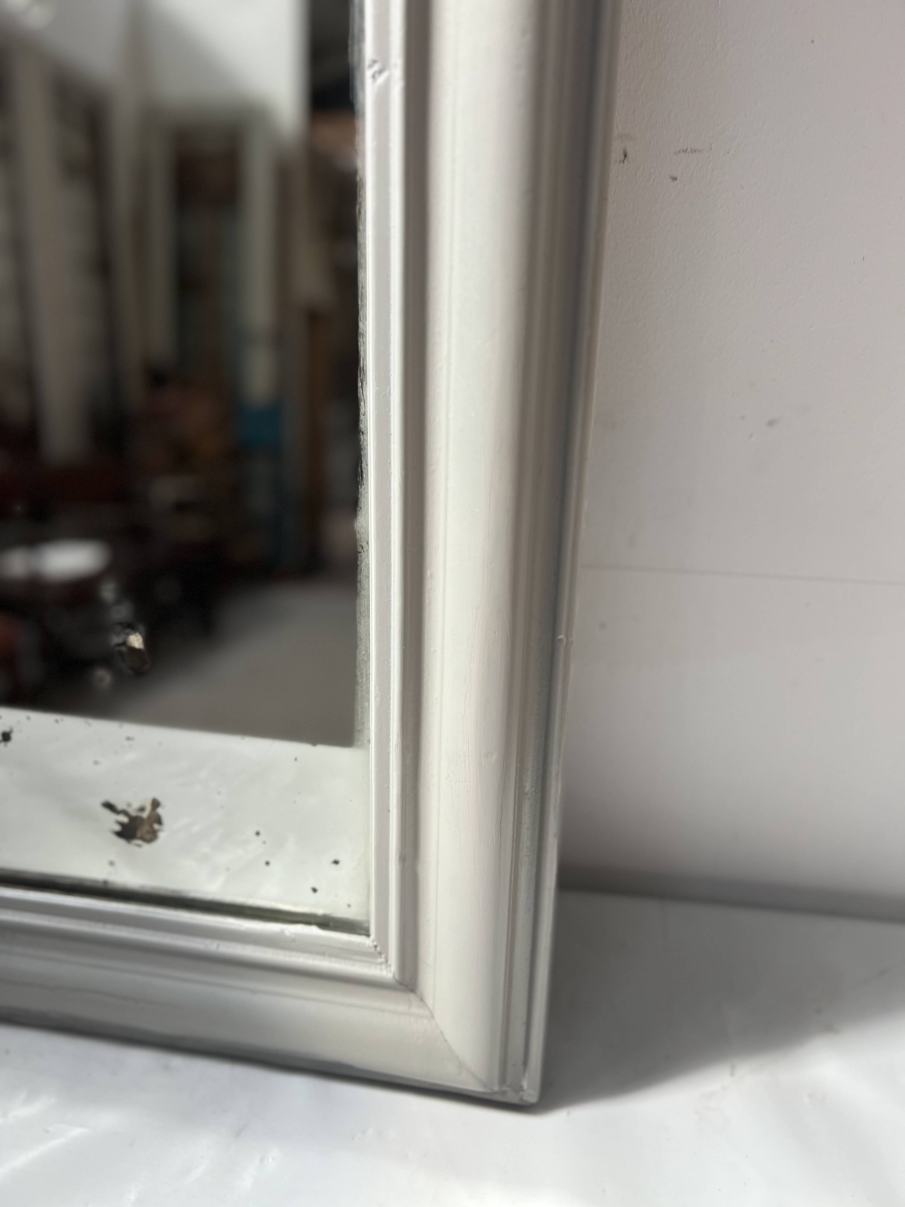 Louis Philippe mirror in wood and patinated stucco, 19th century