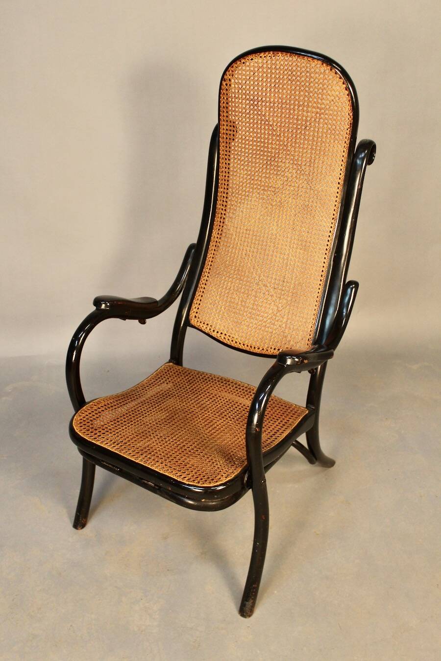 Bentwood cane armchair with mechanism and footrest