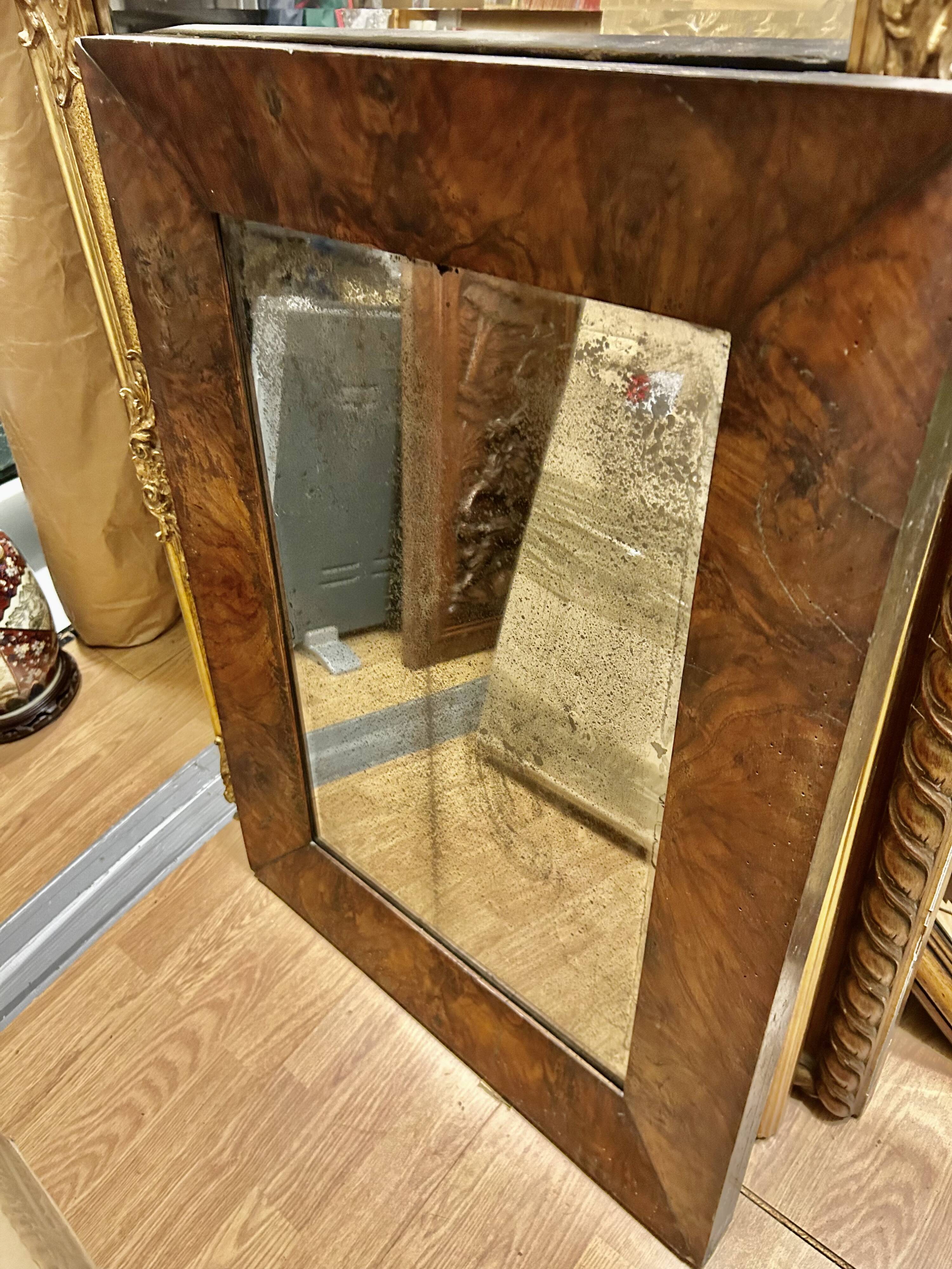 Antique mirror with elm burl molding, heavily demercurized, in its current condition