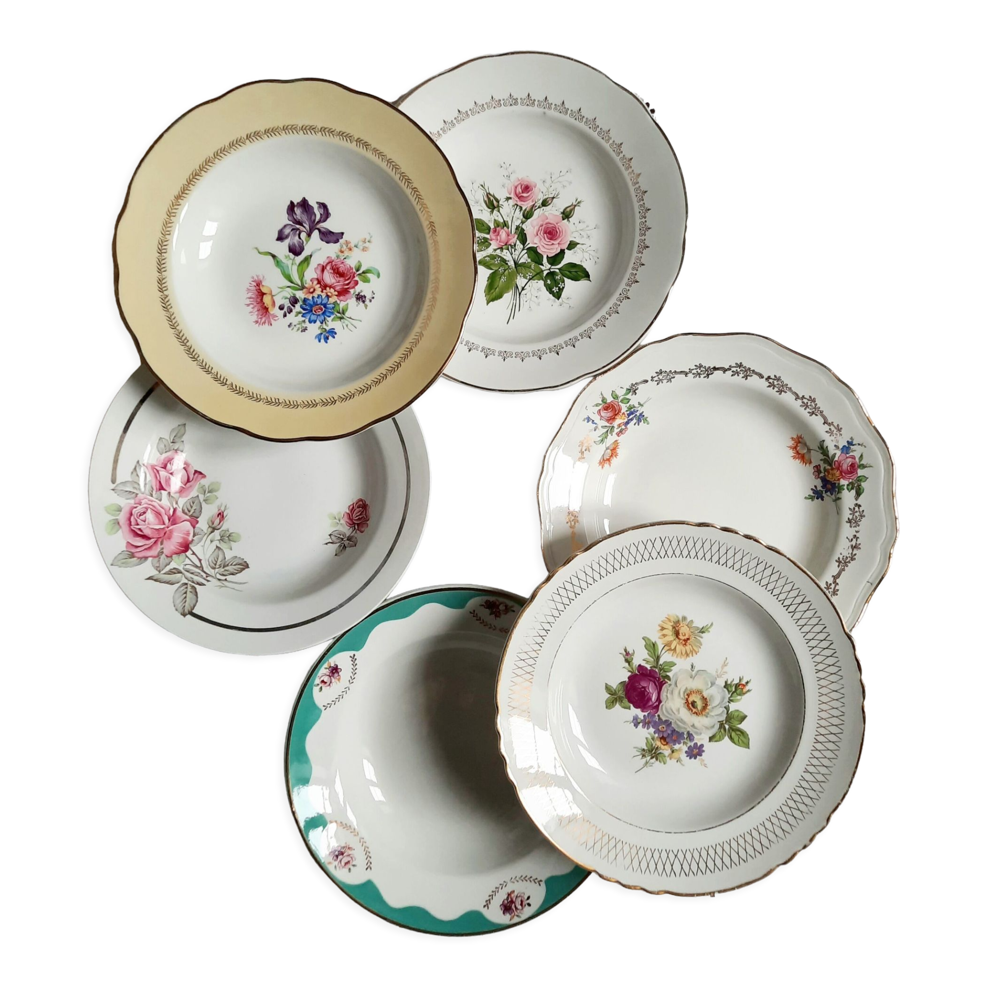 Old hollow plates mismatched in earthenware with gilded edges