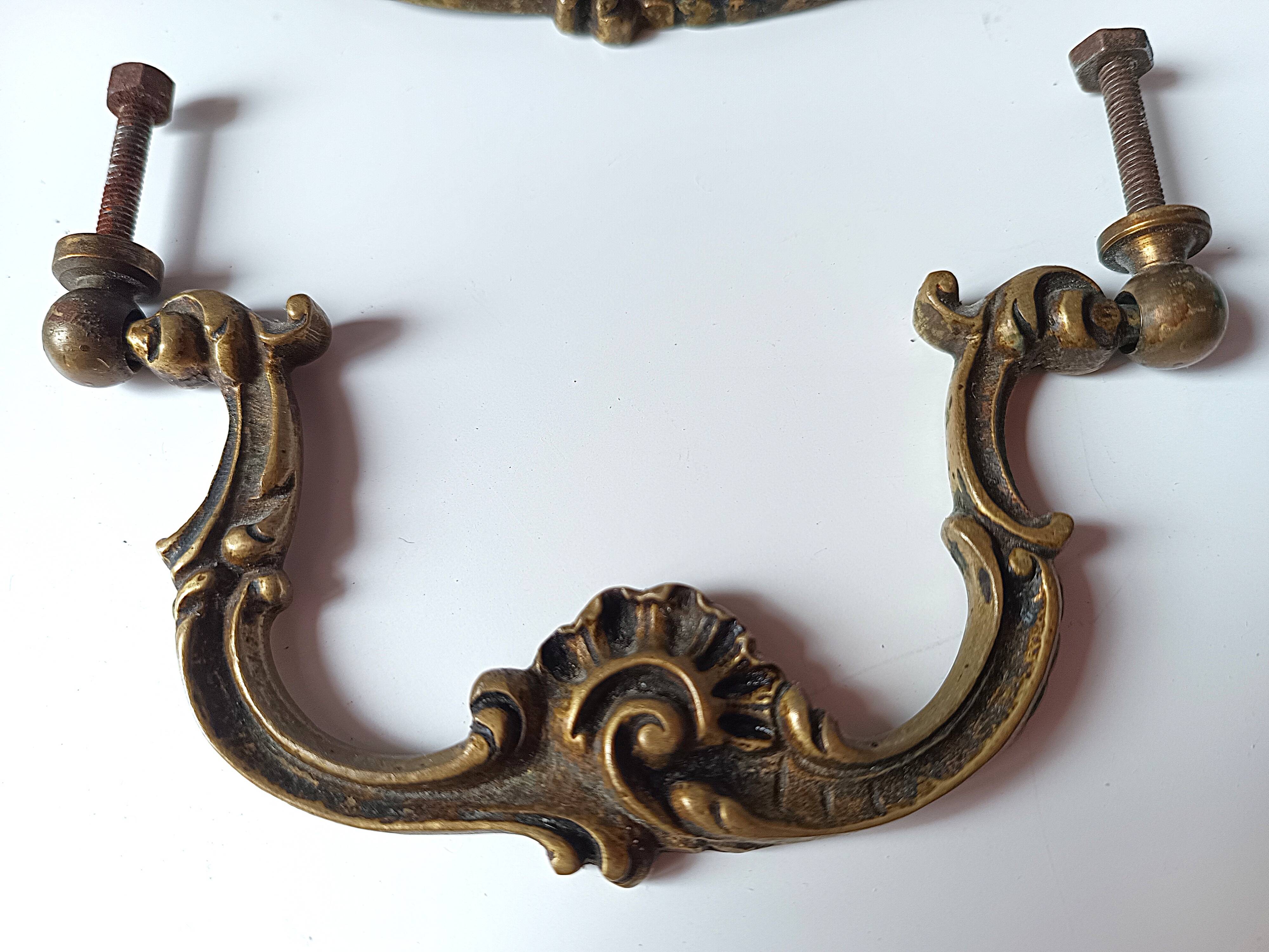 Antique pair of bronze drawer handles.