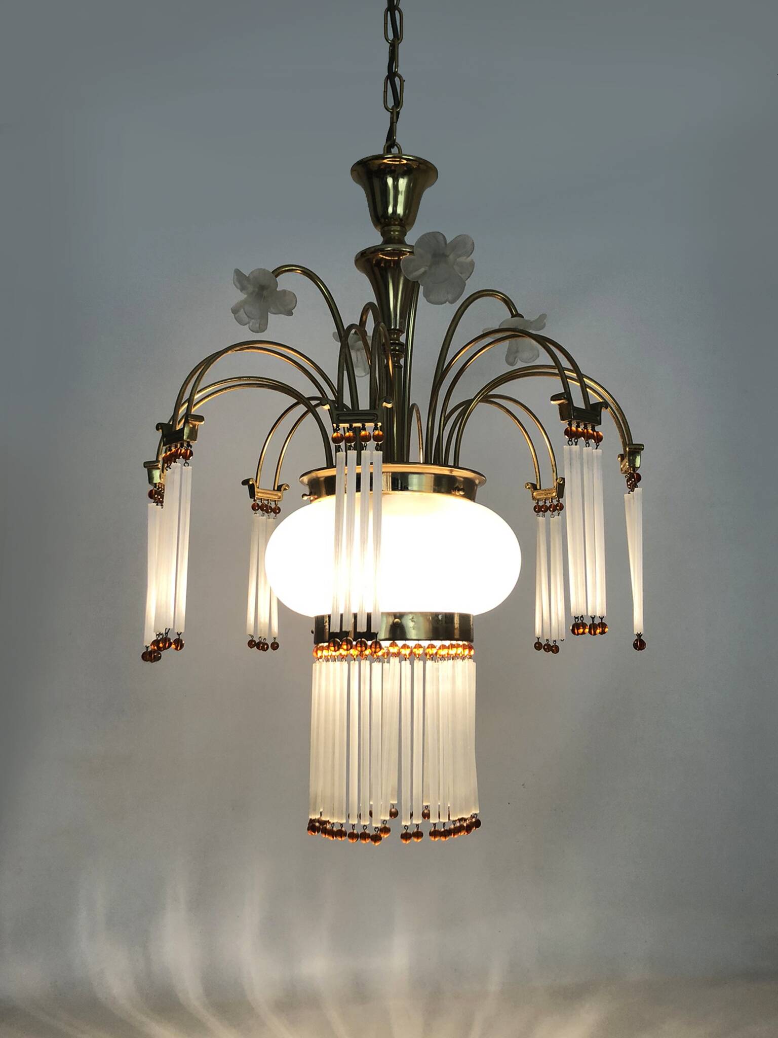 Art Nouveau style chandelier in brass with pendants and glass globe with 3 lights. Italy 70s 80s