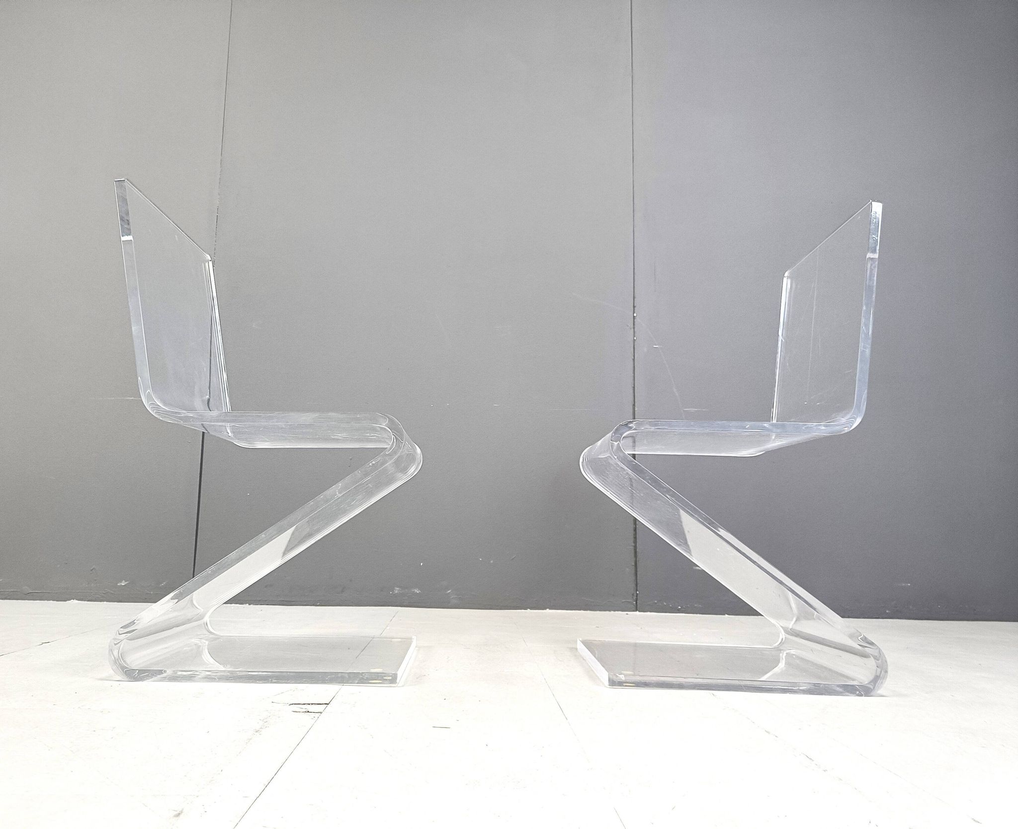 Pair of lucite zigzag dining chairs, 1980s