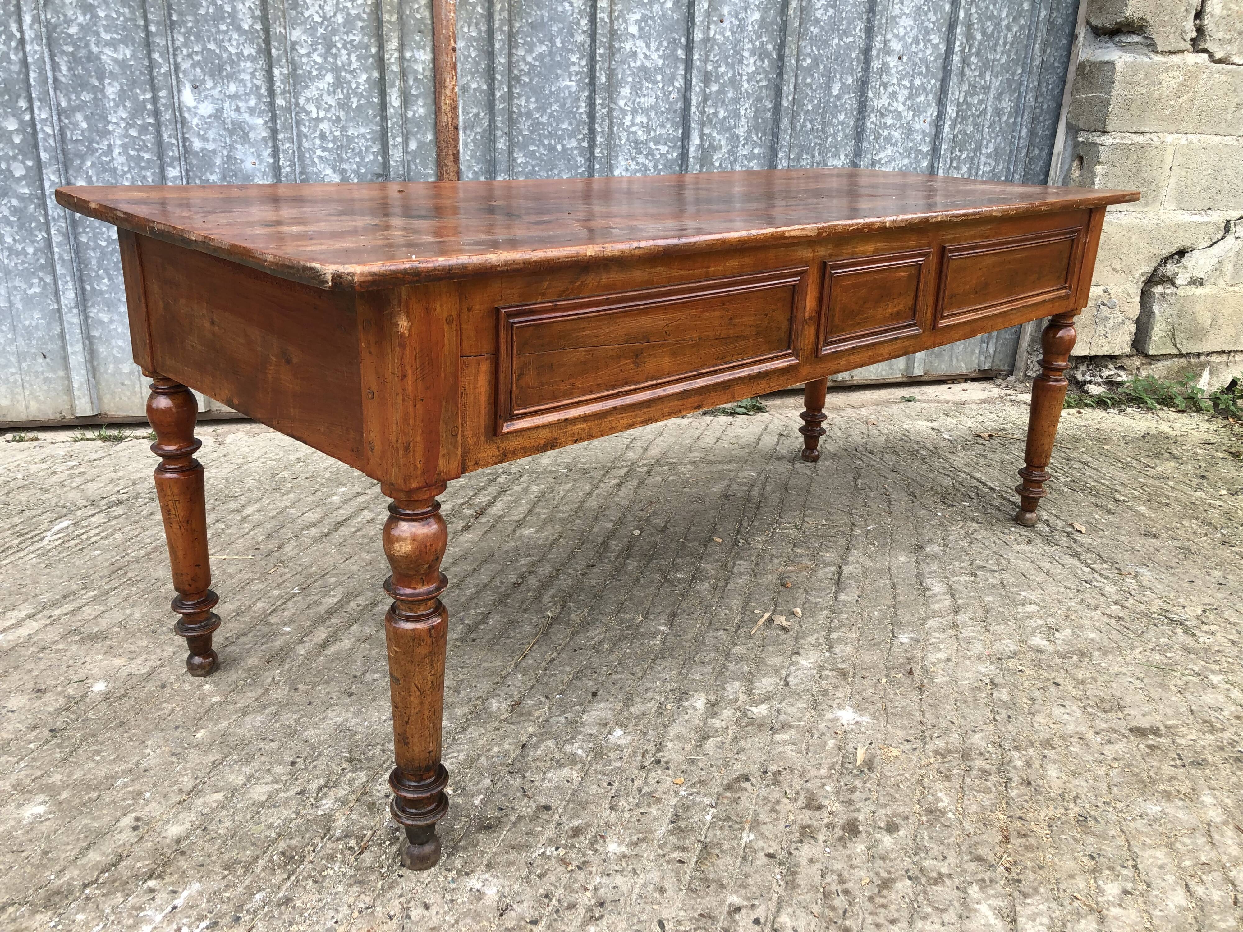 Old farmhouse table in solid cherry wood with 2 front drawers.