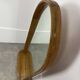 Miroir à tablette cerclage bois, forme ogive, années 60