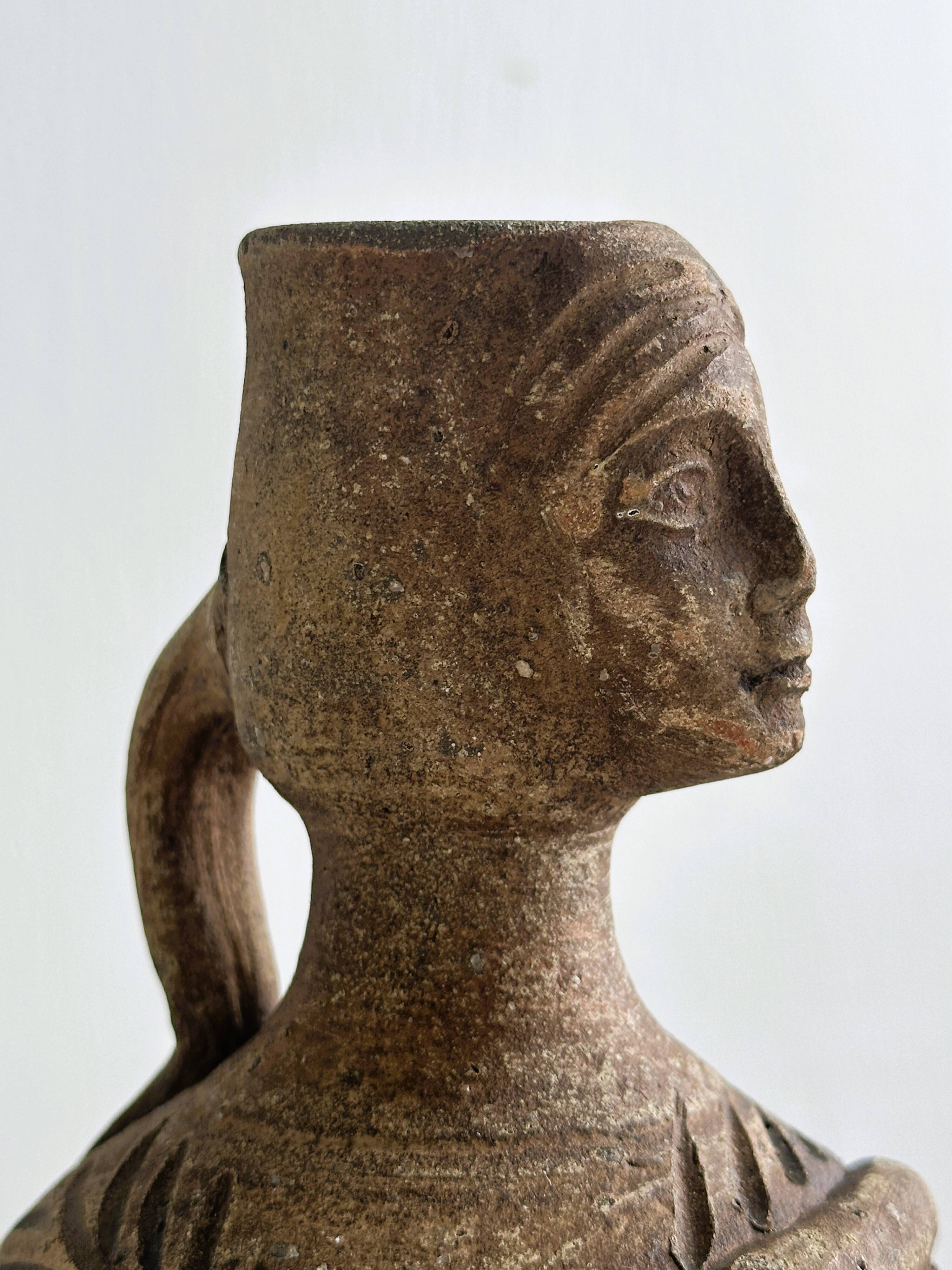 Ceramic woman face vase pitcher.
