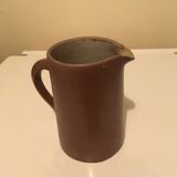 Small pitcher in patinated sandstone