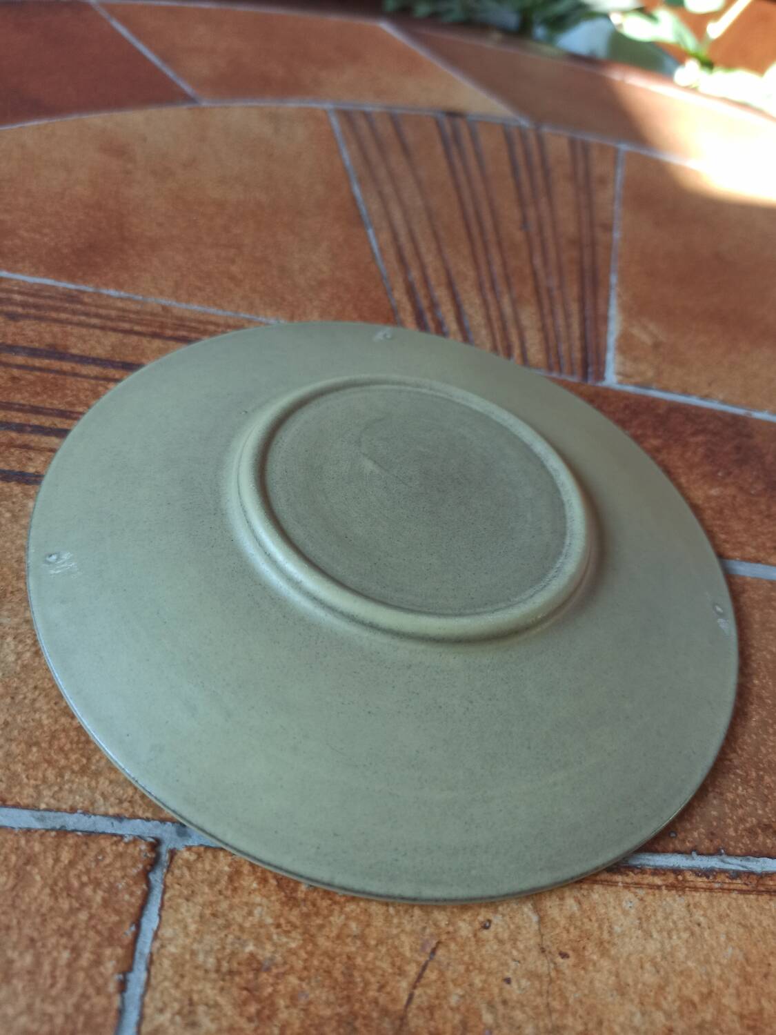 A pair of vintage glazed stoneware cups and saucers.