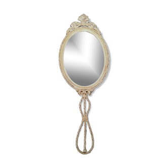 Bevelled hand or hanging mirror in gilded brass