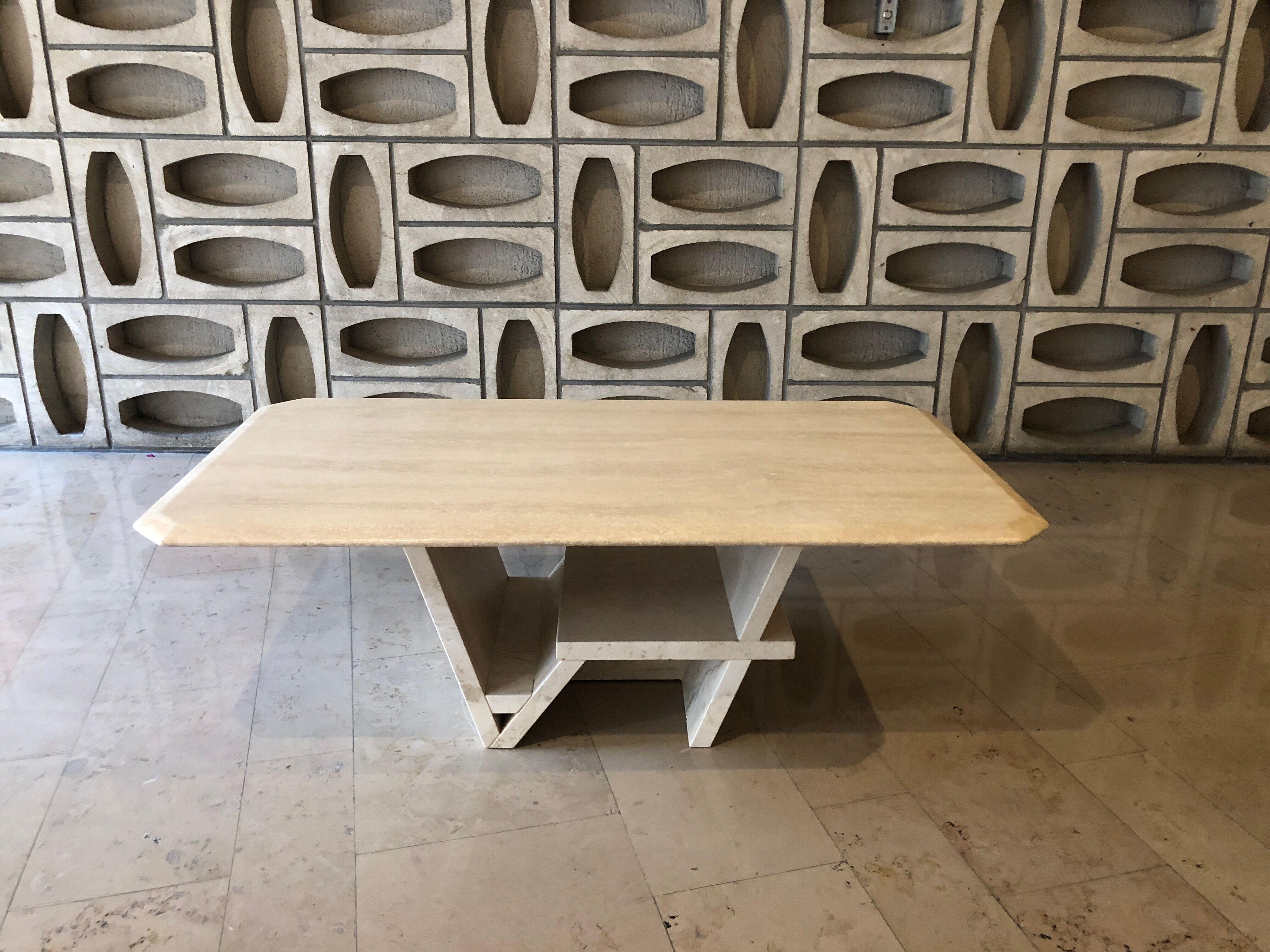Rectangle travertine table with geometric foot