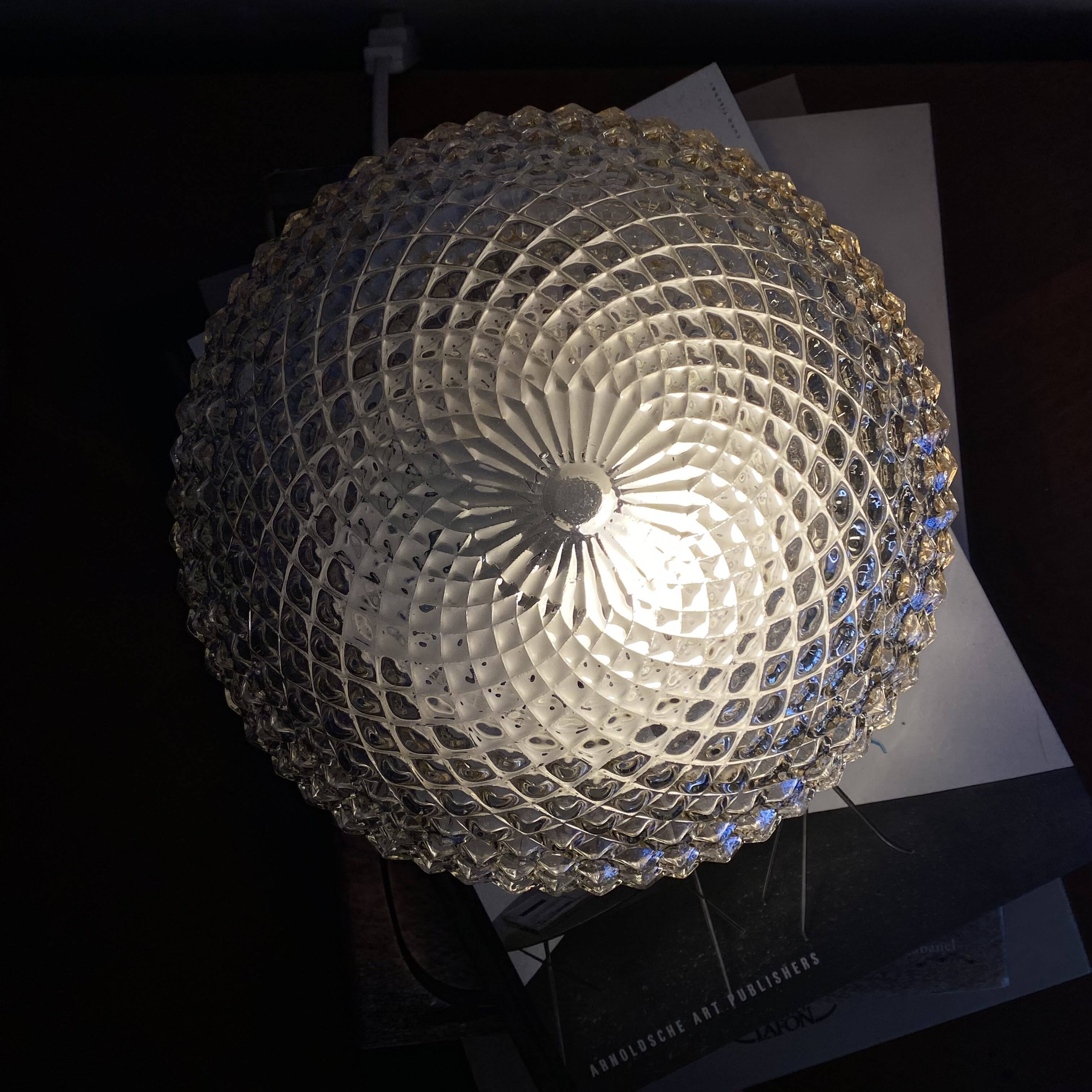 Amber glass wall light or ceiling light with a diamond tip.