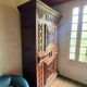 Buffet man standing china cabinet