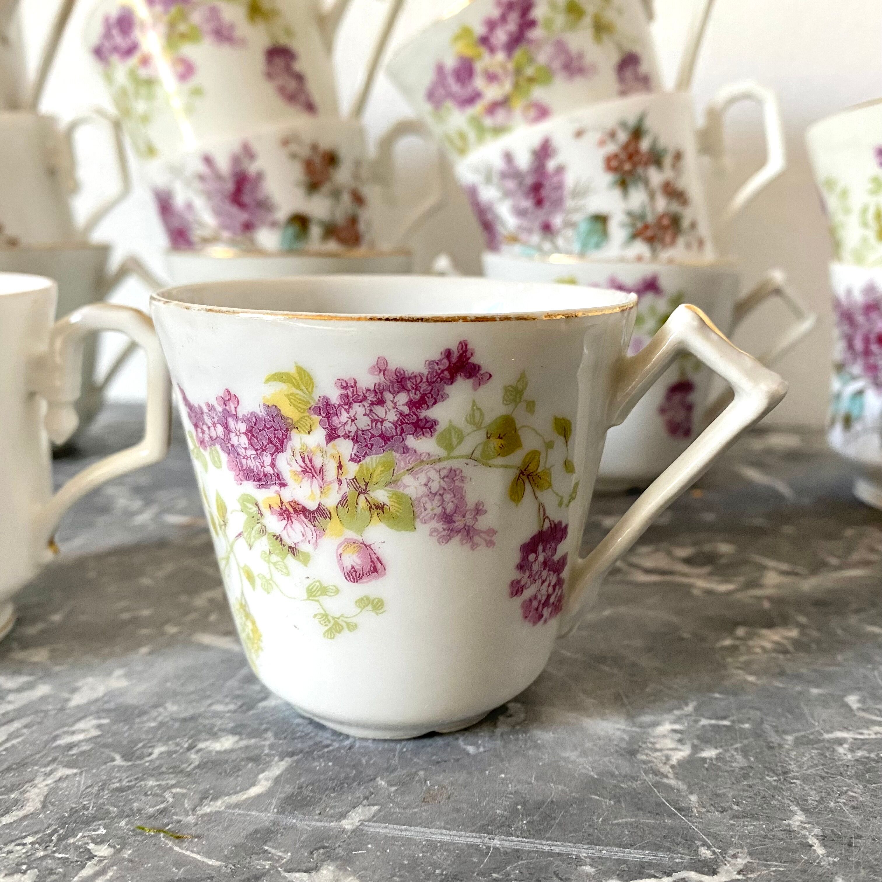 Antique flowered porcelain cups mismatched