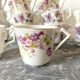 Antique flowered porcelain cups mismatched