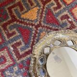 Antique mirror in worked brass