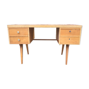 bureau vintage à pieds compas à 4 tiroirs et plateau en formica façon faux bois.