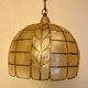 Mother-of-pearl and brass suspension