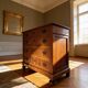 Antique walnut commode with bronze handles in the shape of a lion's mask,