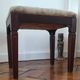 Footrest, vintage stool in solid oak with floral upholstery.